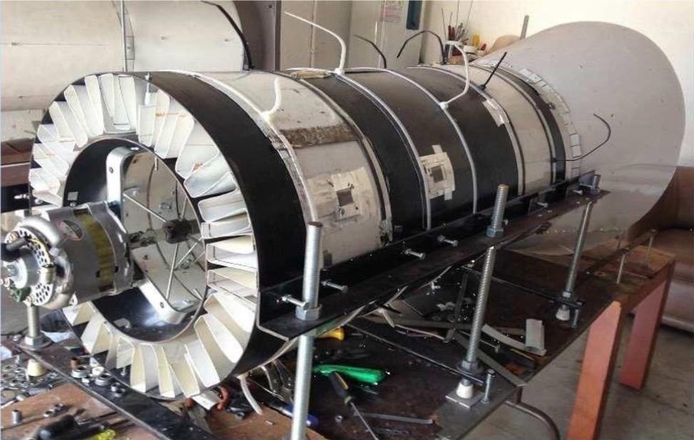 Atom turbine prototype on a workbench