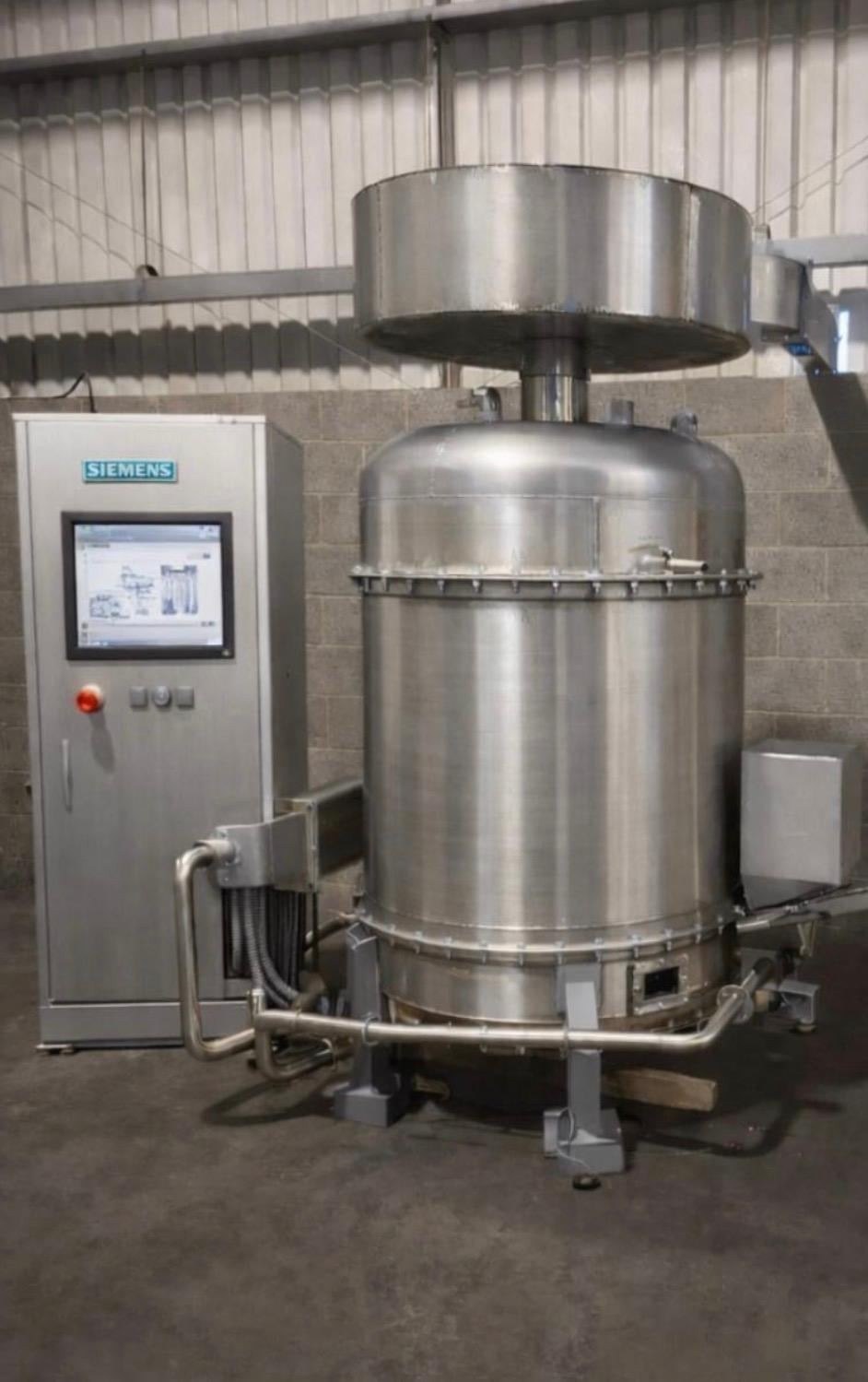 Cyclonox waste-to-energy unit with Siemens control cabinet in a warehouse