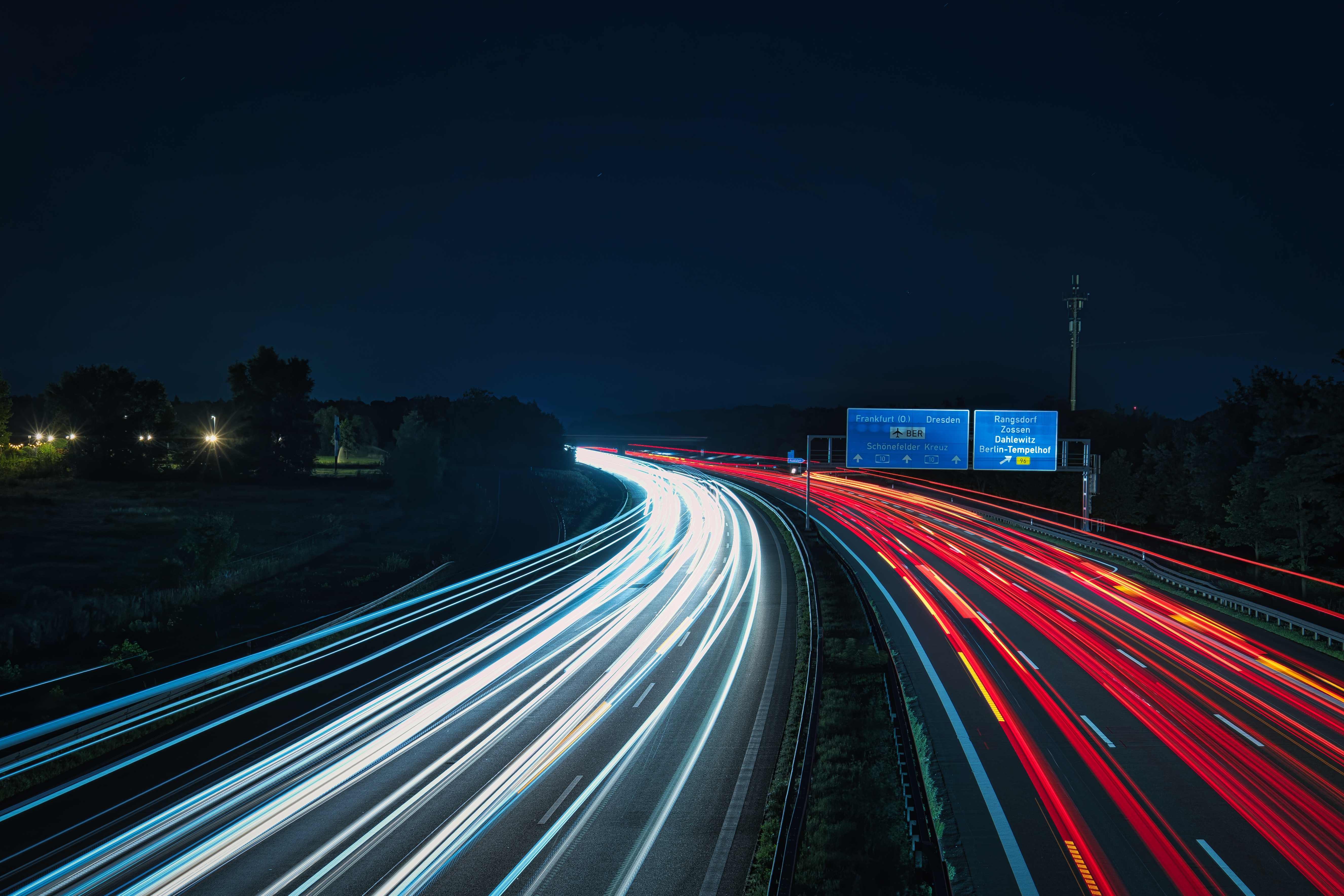 Long-exposure motorway light trails at night